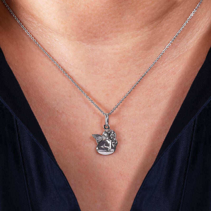 18ct white gold angel pendant on the neck