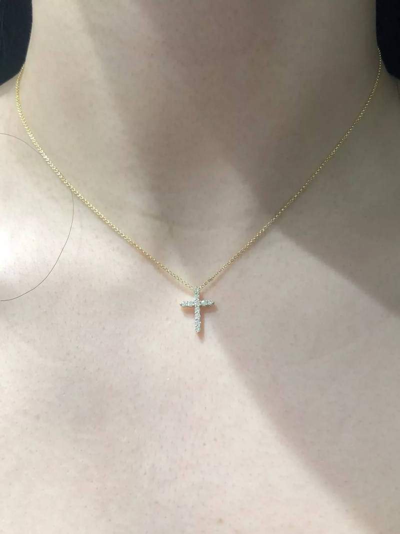 18ct yellow gold diamond cross necklace on the neck