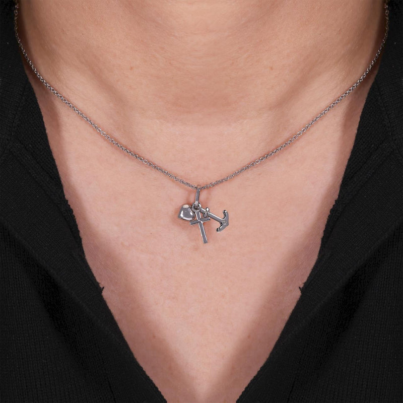 18ct white gold love, cross and anchor pendant on the neck
