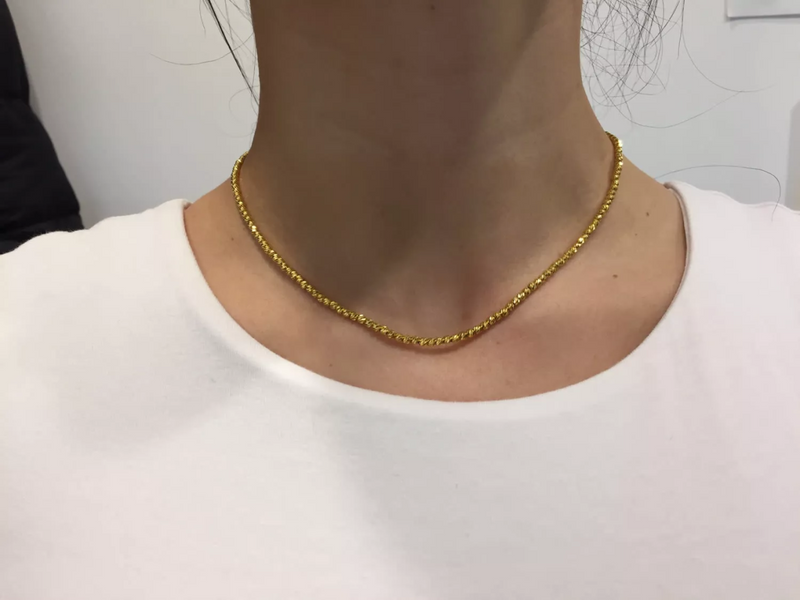18ct yellow gold 40cm ball necklace on the neck