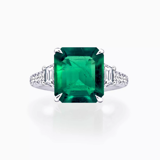 18ct white gold 3.95ct square emerald cut Colombian Emerald, step cut trapezoid and round brilliant cut diamond ring