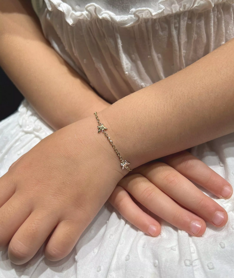 18ct yellow and white gold butterflies baby bracelet on wrist
