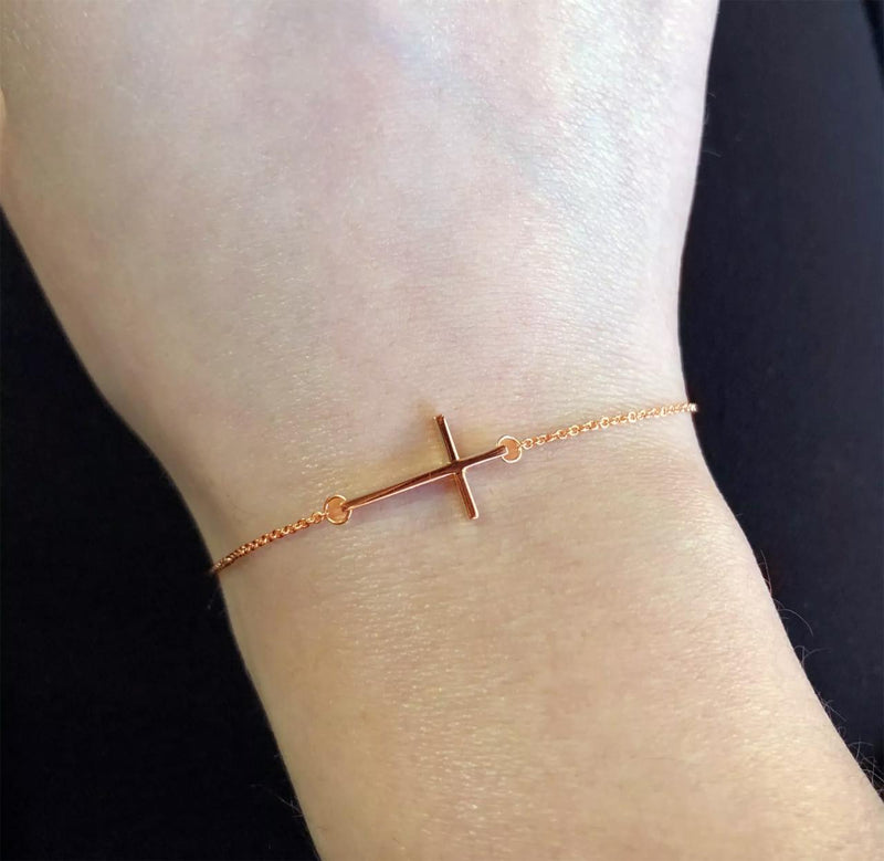 18ct rose gold cross bracelet on the wrist