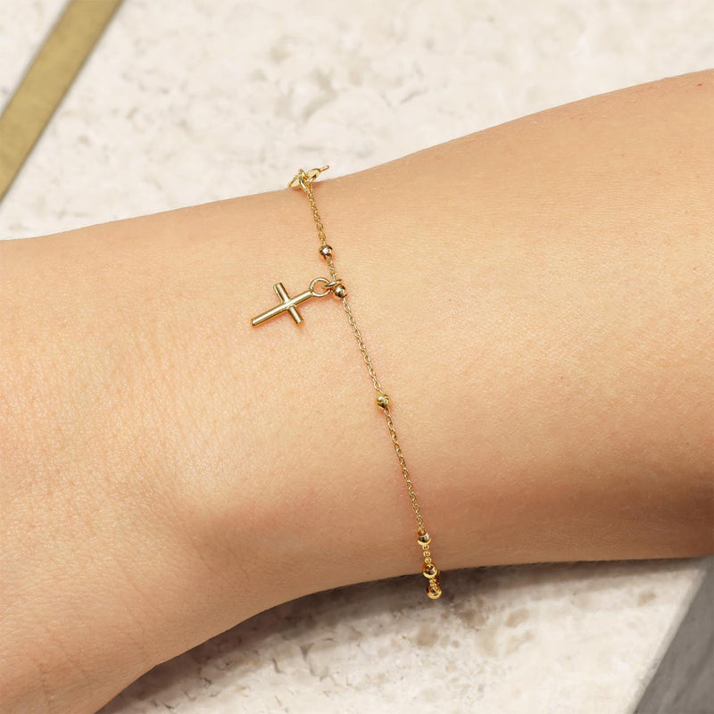 18ct yellow gold rosary beads bracelet with cross on the wrist