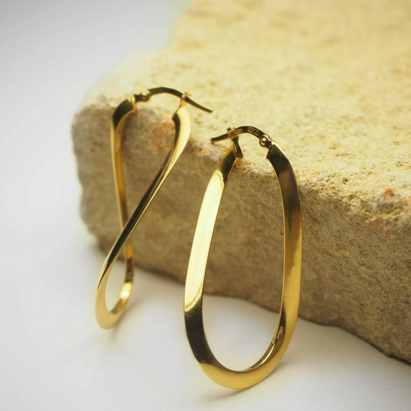 A pair of 18ct yellow gold flat hoop earrings measuring 40mm.