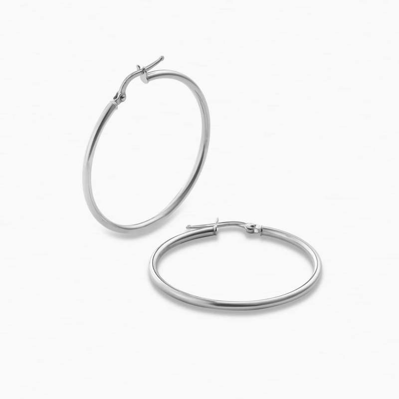 A pair of 18ct white gold 30mm hoop earrings on a white background.