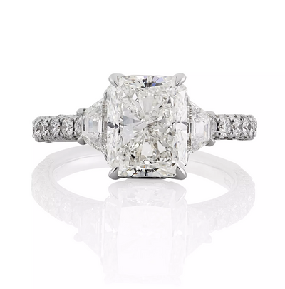 Platinum radiant and trapezoid trilogy round brilliant cut diamond ring