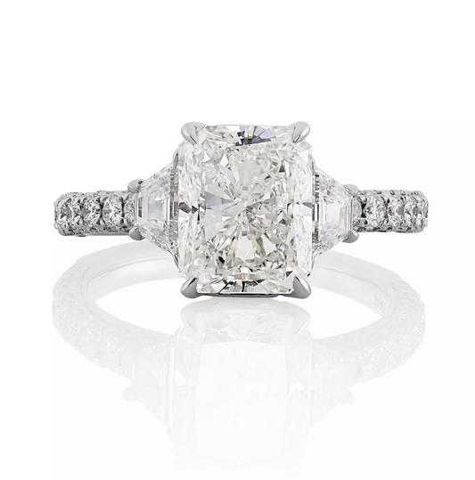 Platinum radiant and trapezoid trilogy round briliant cut diamond ring