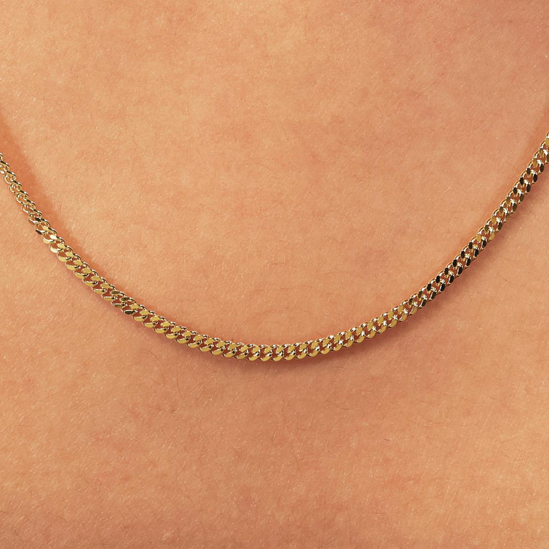 18ct yellow gold 50cm fine flat curb link chain on the neck