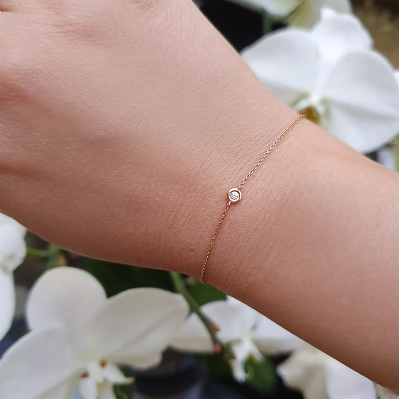18ct rose gold single diamond bezel bracelet on wrist