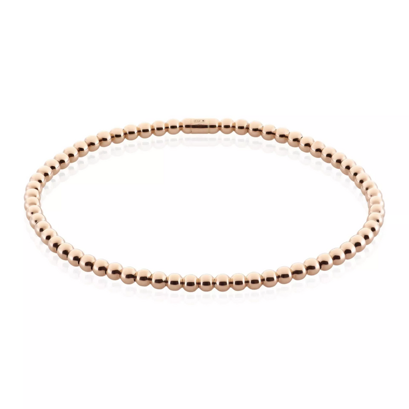 A stretchable 18ct rose gold ball bracelet displayed against a white background.