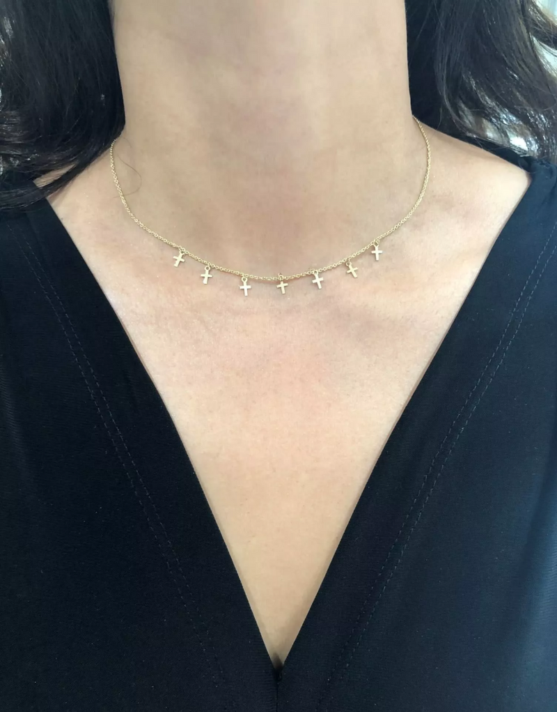 18ct yellow gold cross necklace on the neck