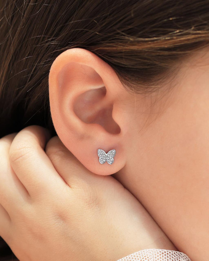 18ct white gold diamond butterfly stud earrings on the ear