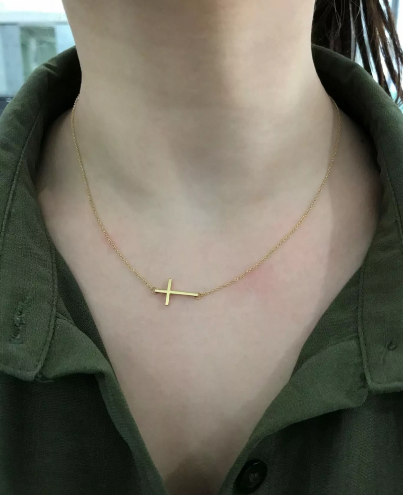 18ct yellow gold 42cm cross necklace on the neck