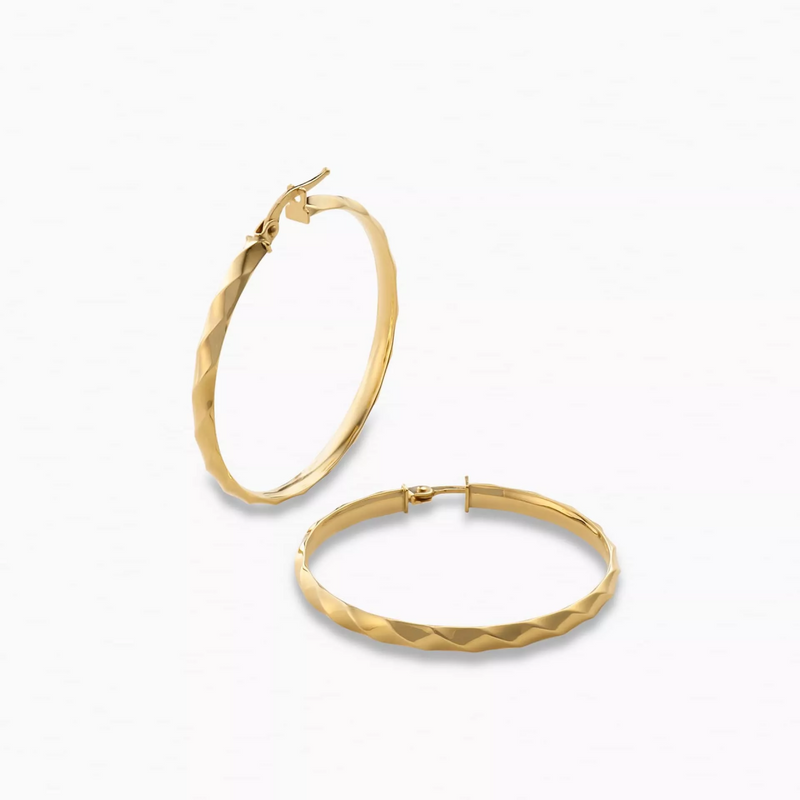 A pair of 18ct yellow gold 30mm hoop earrings on a white background.