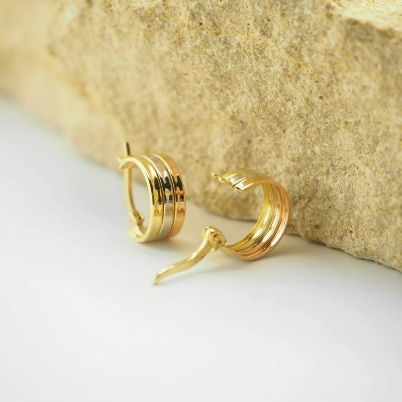 A pair of 18ct yellow, rose, and white gold hoop earrings with a diameter of 10mm.