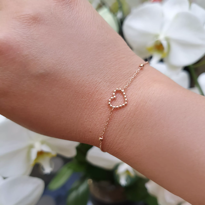 18ct rose gold heart shape bracelet on the wrist