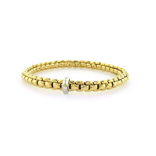 18ct yellow gold stretch bracelet with an 18ct white gold rondel. 2mm