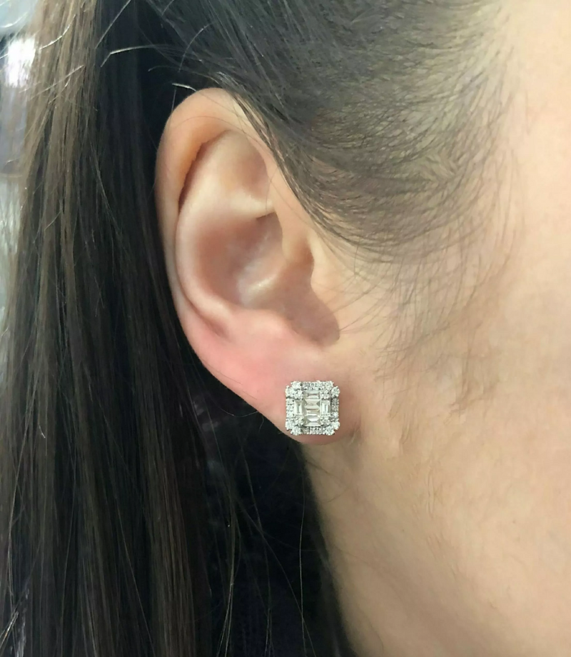 18ct yellow gold claw set baguette & round brilliant cut diamond stud earring on ear