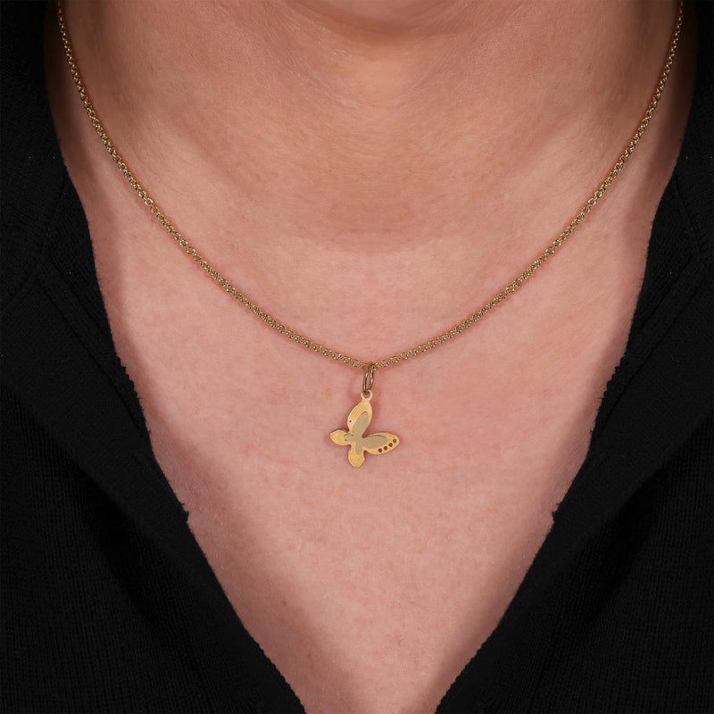 18ct yellow gold butterfly pendant on the neck