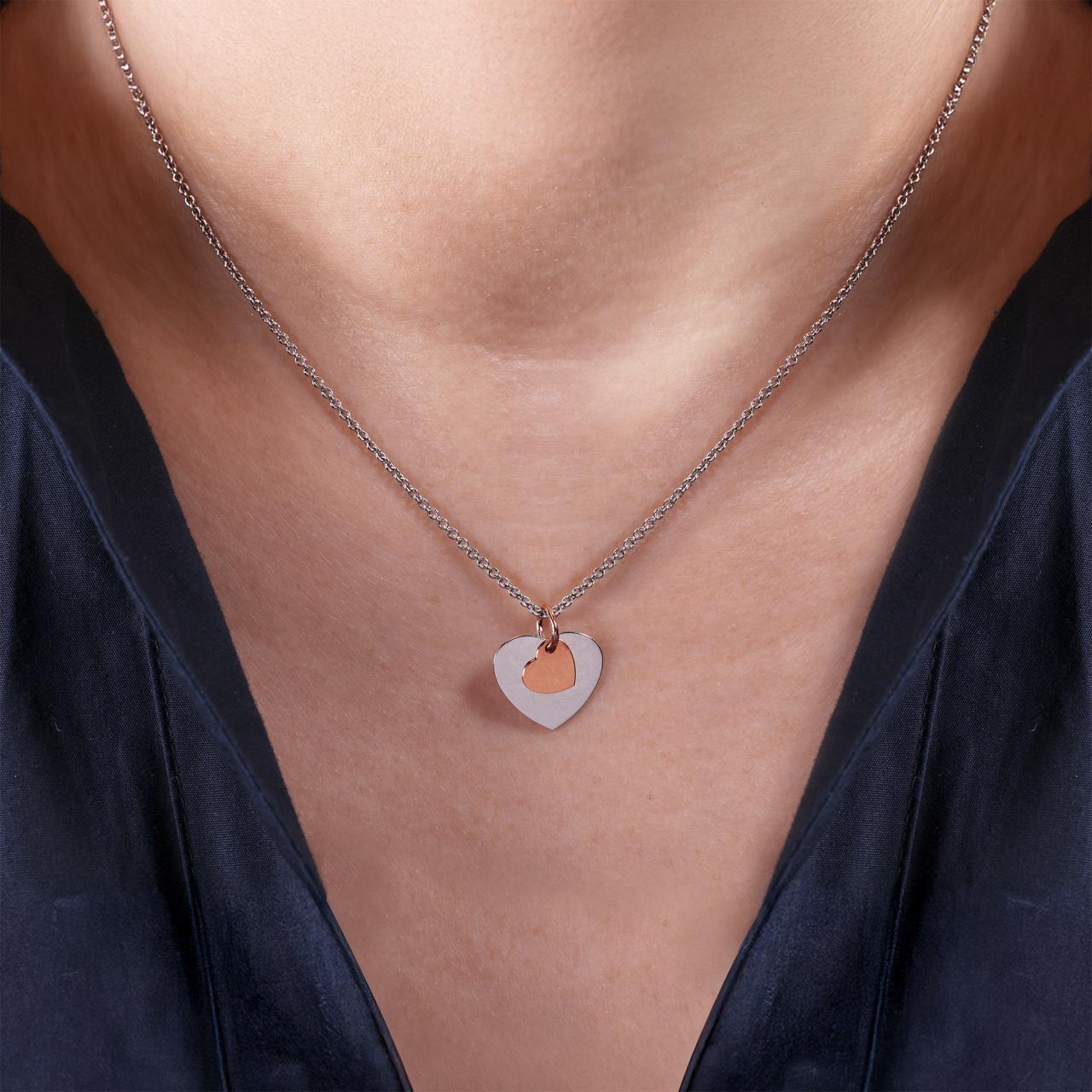 18ct white and rose gold heart pendant on the neck