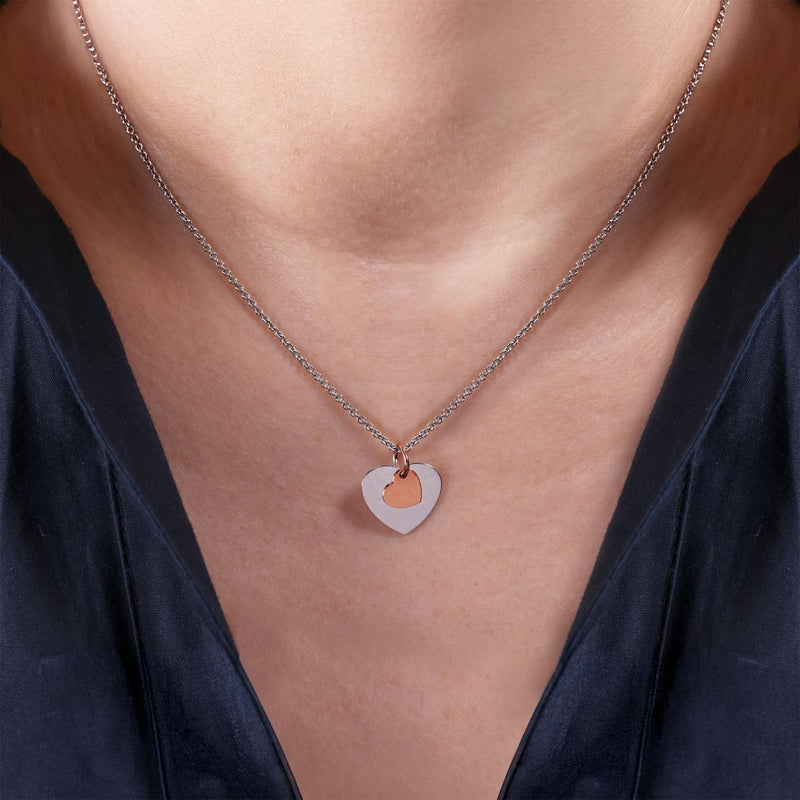 18ct white and rose gold heart pendant on the neck