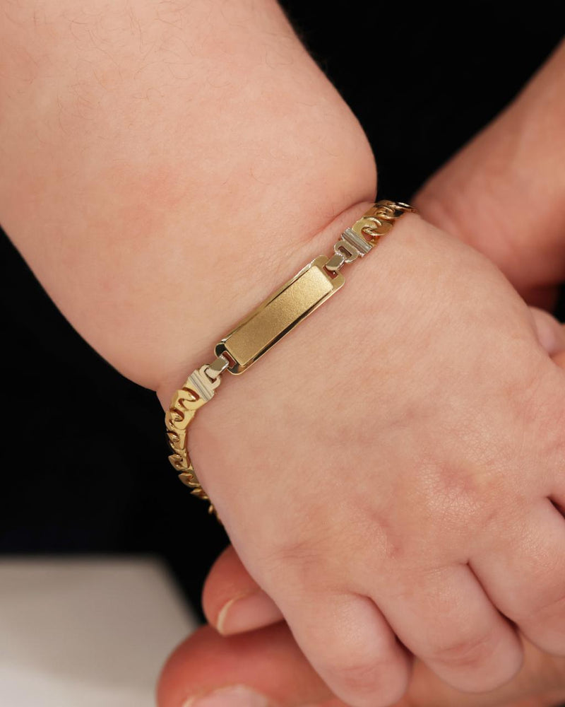 18ct yellow gold identity baby bracelet on baby wrist