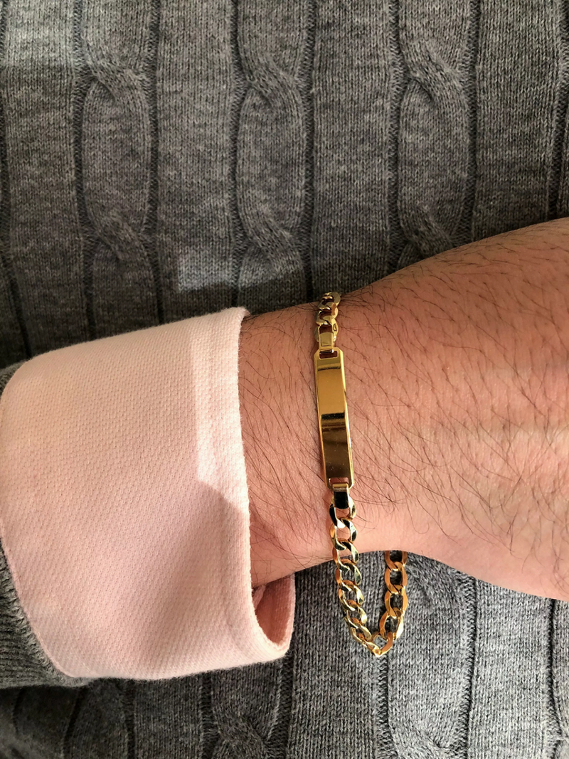 18ct yellow gold ID tag cuban chain bracelet on the wrist