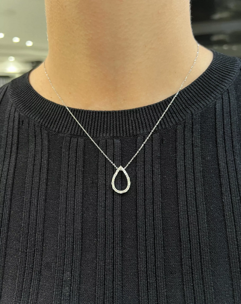 18ct white gold pear shape baguette and round diamond necklace on neck