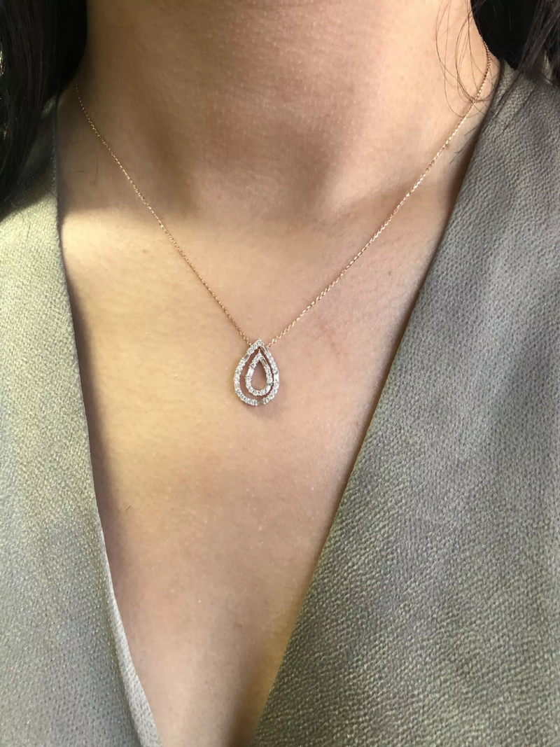 18ct rose gold double pear shape diamond necklace on the neck