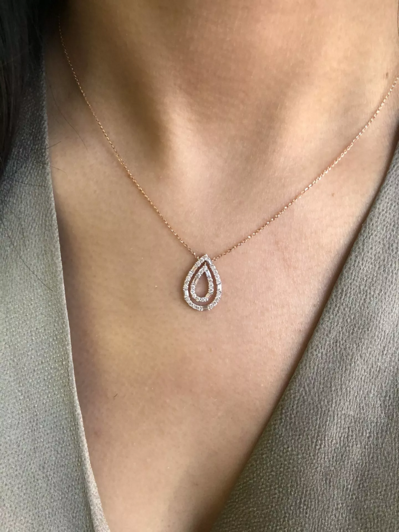 18ct rose gold double pear shape diamond necklace on the neck