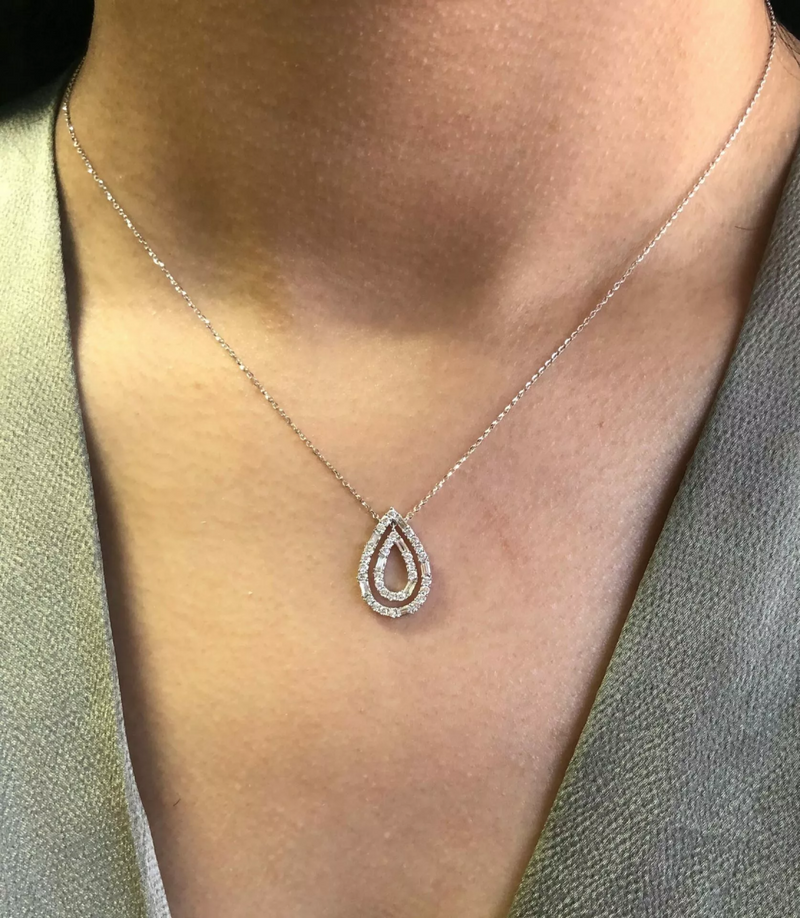 18ct white gold double pear shape diamond necklace on the neck