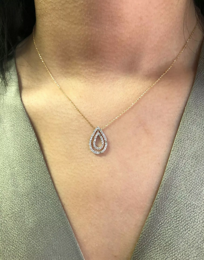 18ct yellow gold double pear shape diamond necklace on the neck