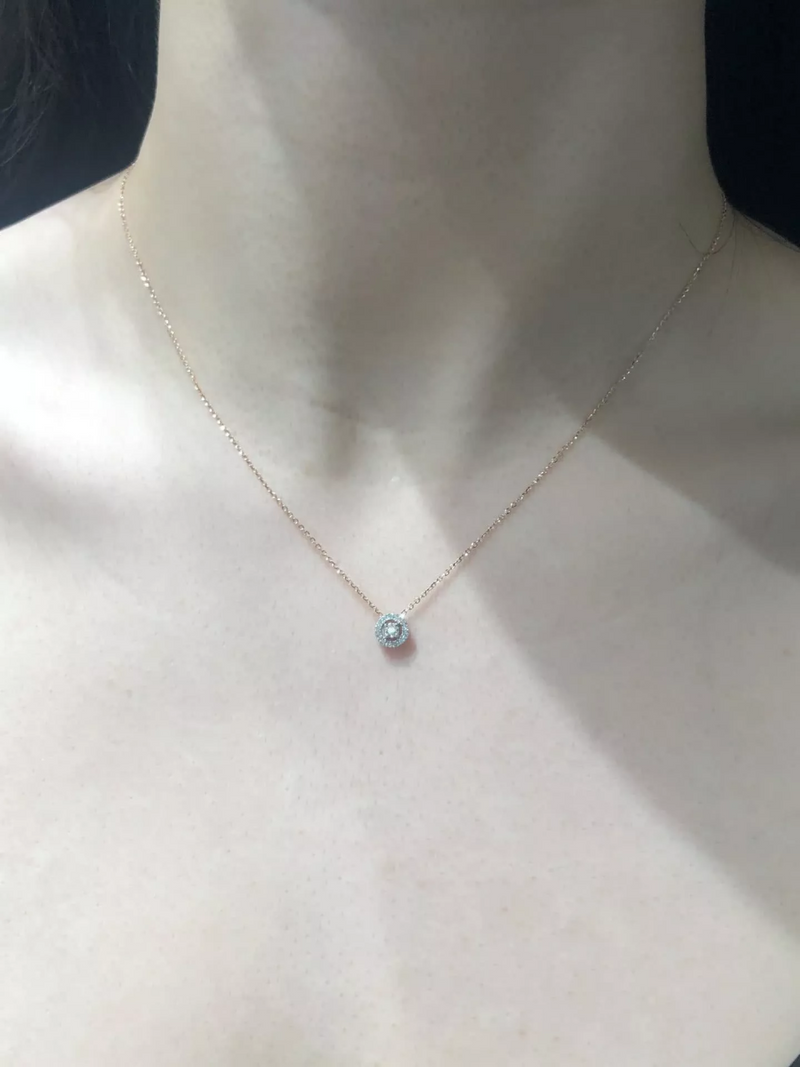 18ct rose gold round cluster diamond halo necklace on the neck