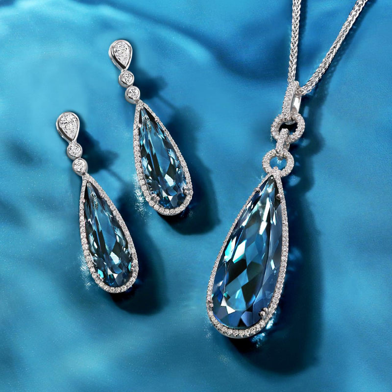 18ct white gold pear cut London blue topaz and diamond drop pendant