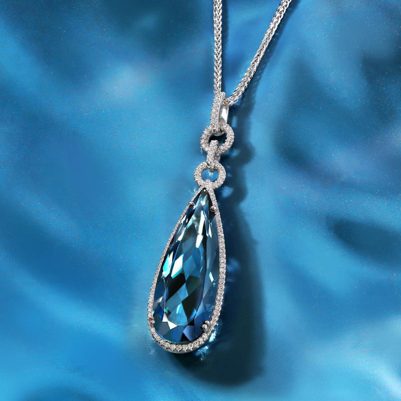 18ct white gold pear cut London blue topaz and diamond drop pendant