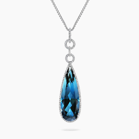 18ct white gold 18.28ct pear cut London blue topaz and diamond drop pendant