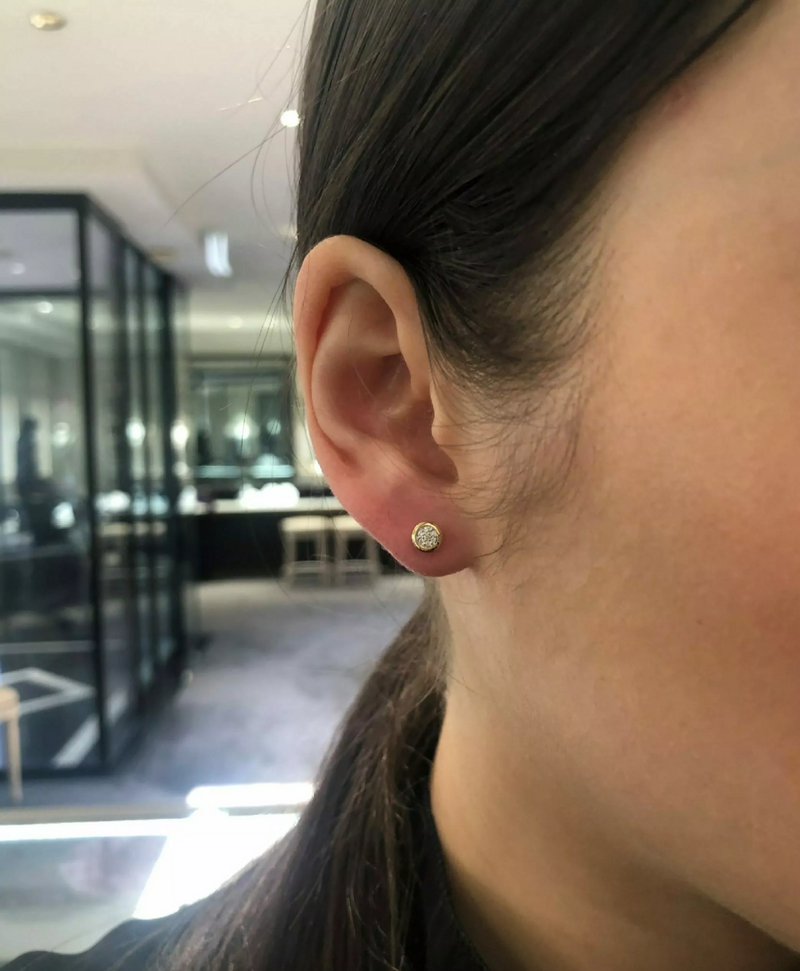 18ct yellow gold diamond cluster bezel stud earrings on the ear