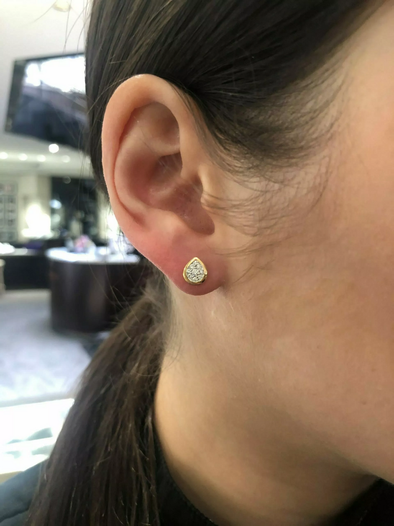 18ct yellow gold pear shape cluster diamond bezel earrings on ear