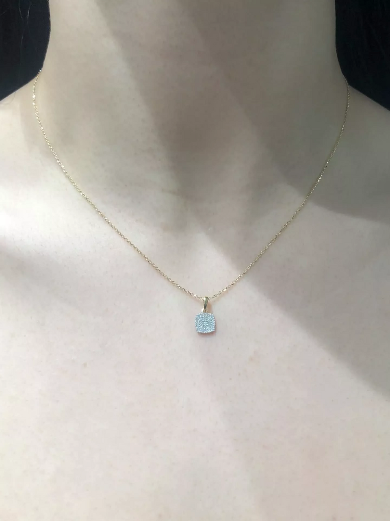 18ct yellow gold cushion shape cluster diamond necklace on the neck
