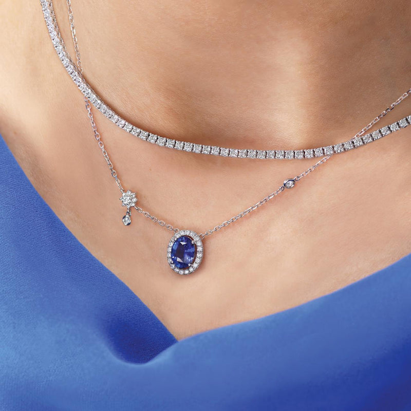 18ct white gold unheated oval Ceylon sapphire and diamond necklace on the neck