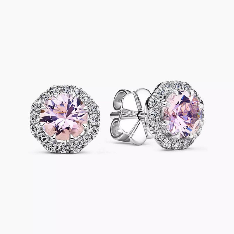 A pair of 18ct white gold morganite and diamond stud earrings with round brilliant cut diamonds surrounding a central morganite gemstone.