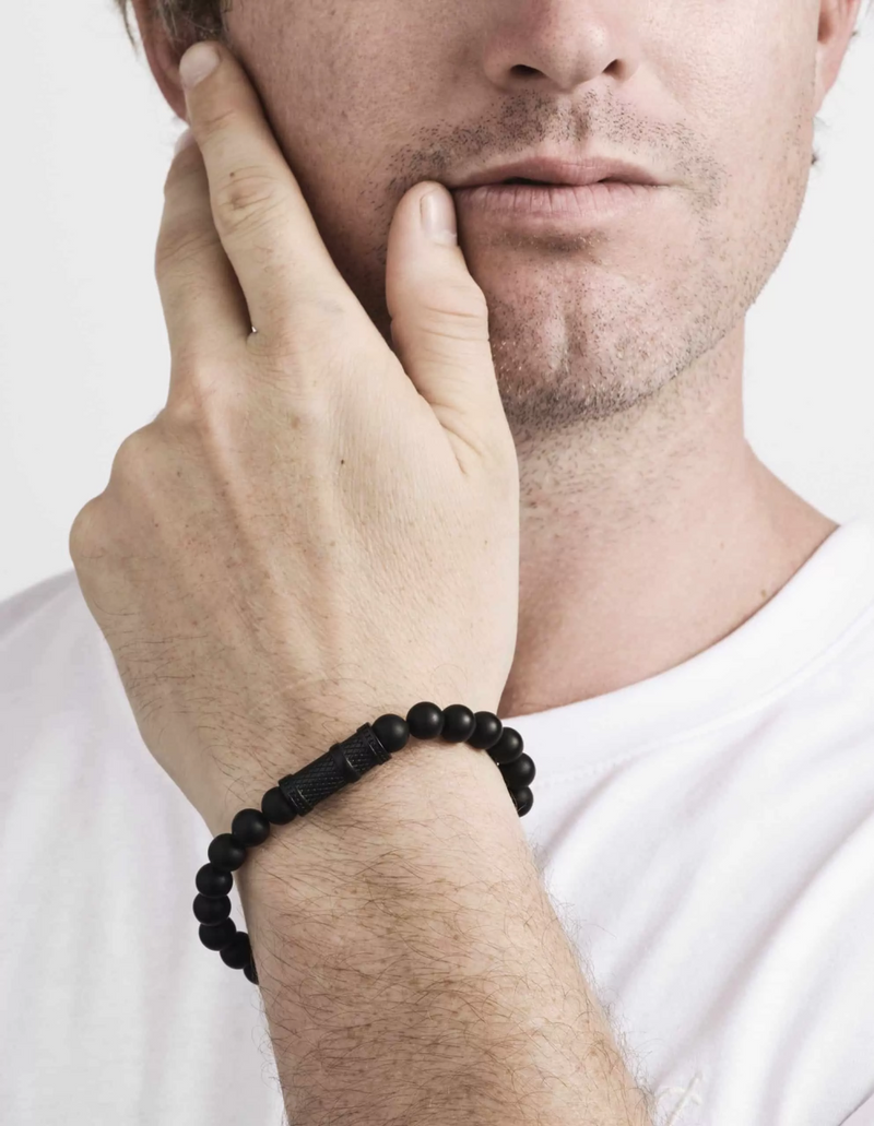 Black agate and stainless steel beaded men's bracelet on the wrist