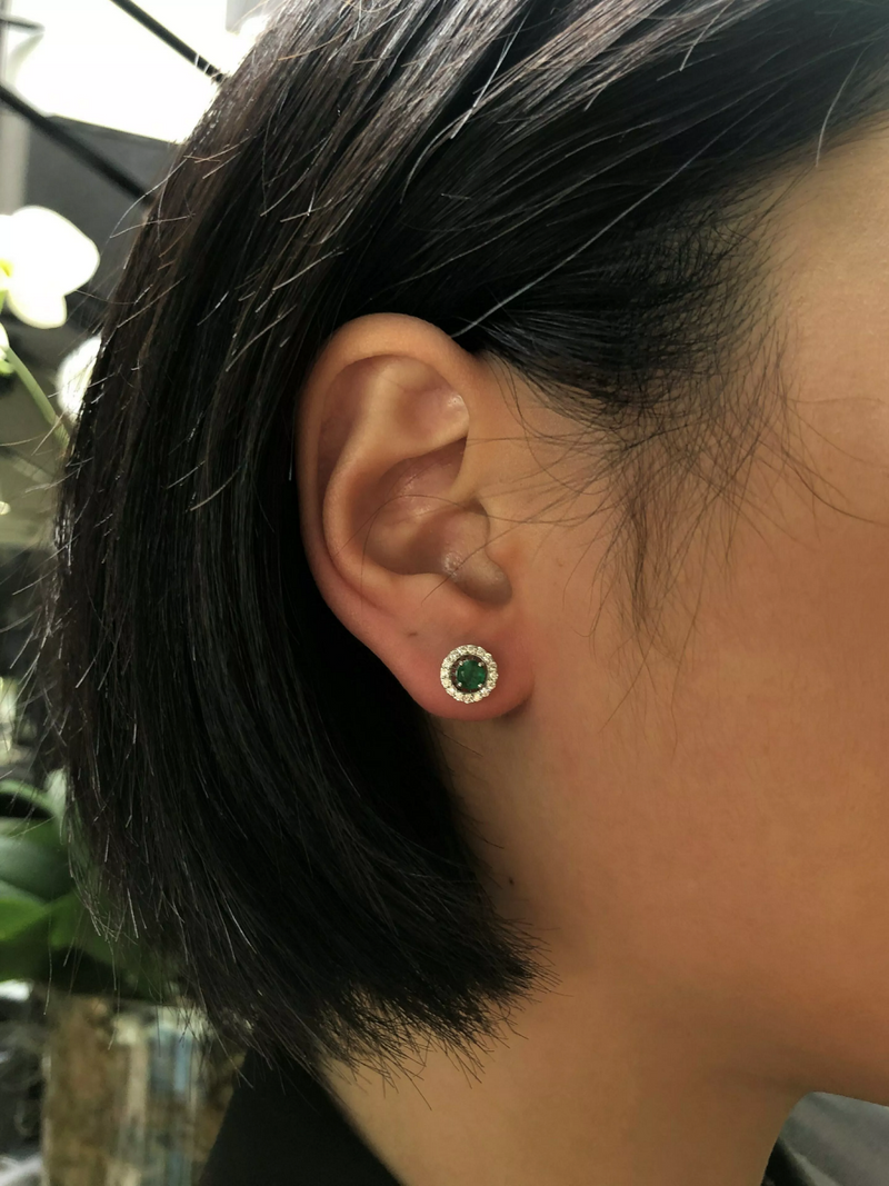 18ct white gold emerald and diamond removable halo earrings on ear