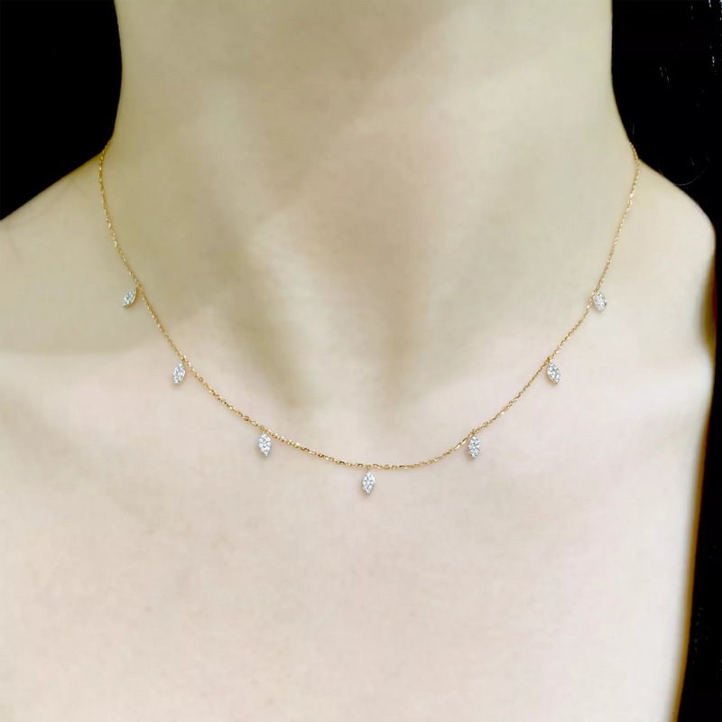 18ct rose gold diamond set leaf style drop necklace on the neck