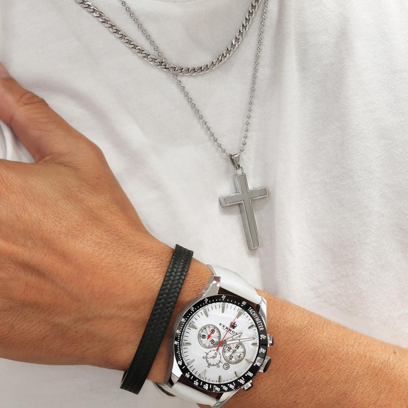 Polished stainless steel cross necklace on the neck