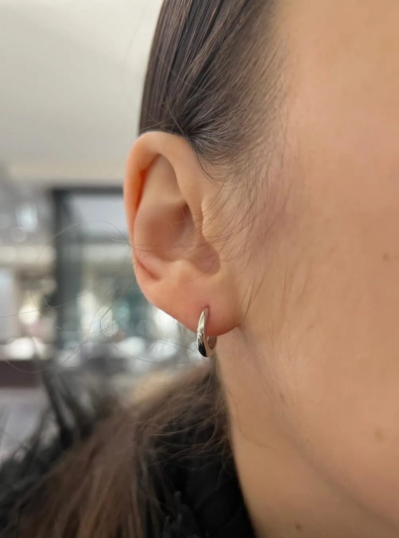 18ct white gold small hoop earrings on the ear