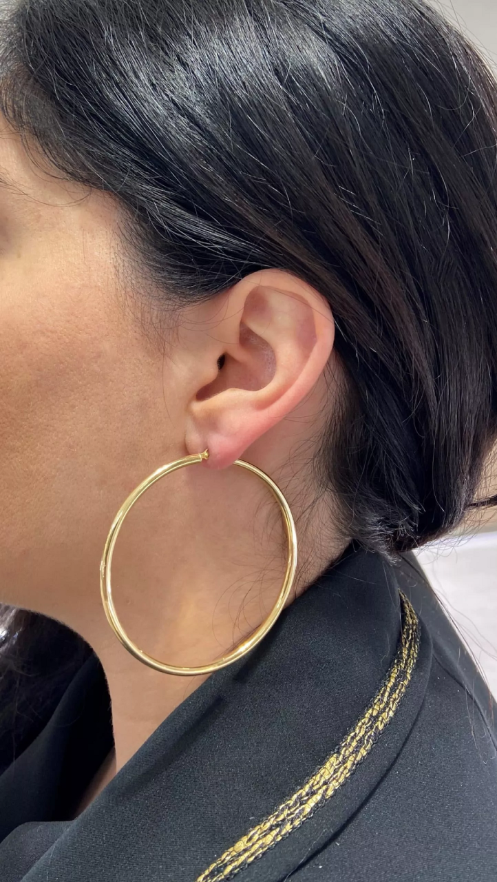 A pair of 18ct yellow gold large hoop earrings with a diameter of 60mm on the ear