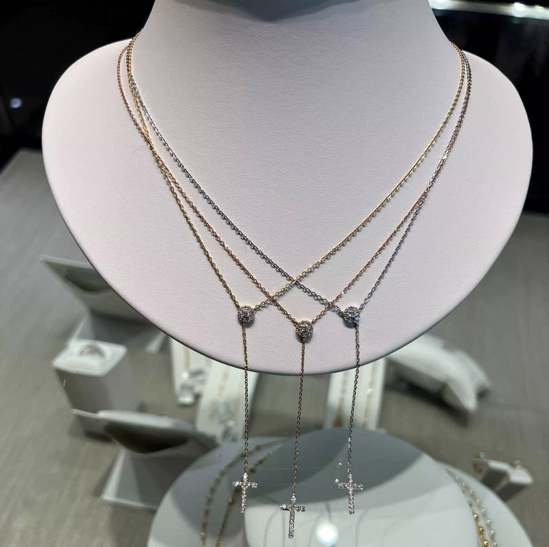 18ct rose gold diamond set drop cross necklace along with showcasing white gold and yellow gold