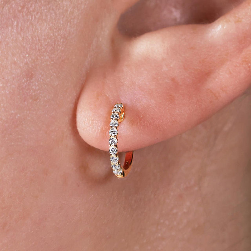 18ct yellow gold 20=0.25ct diamond hoop earrings on ear